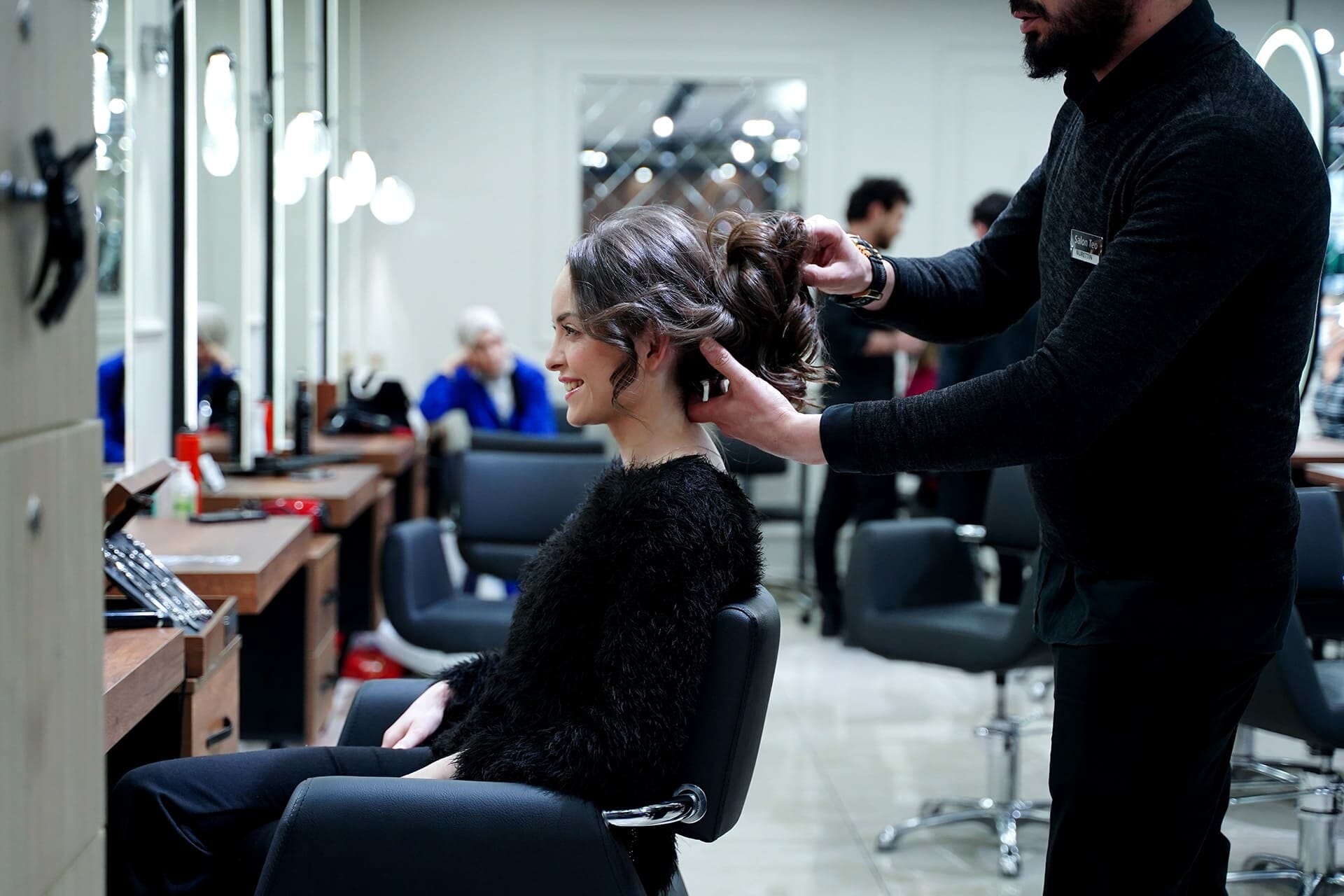 Updo hair design: wavy hair being gathered and pinned